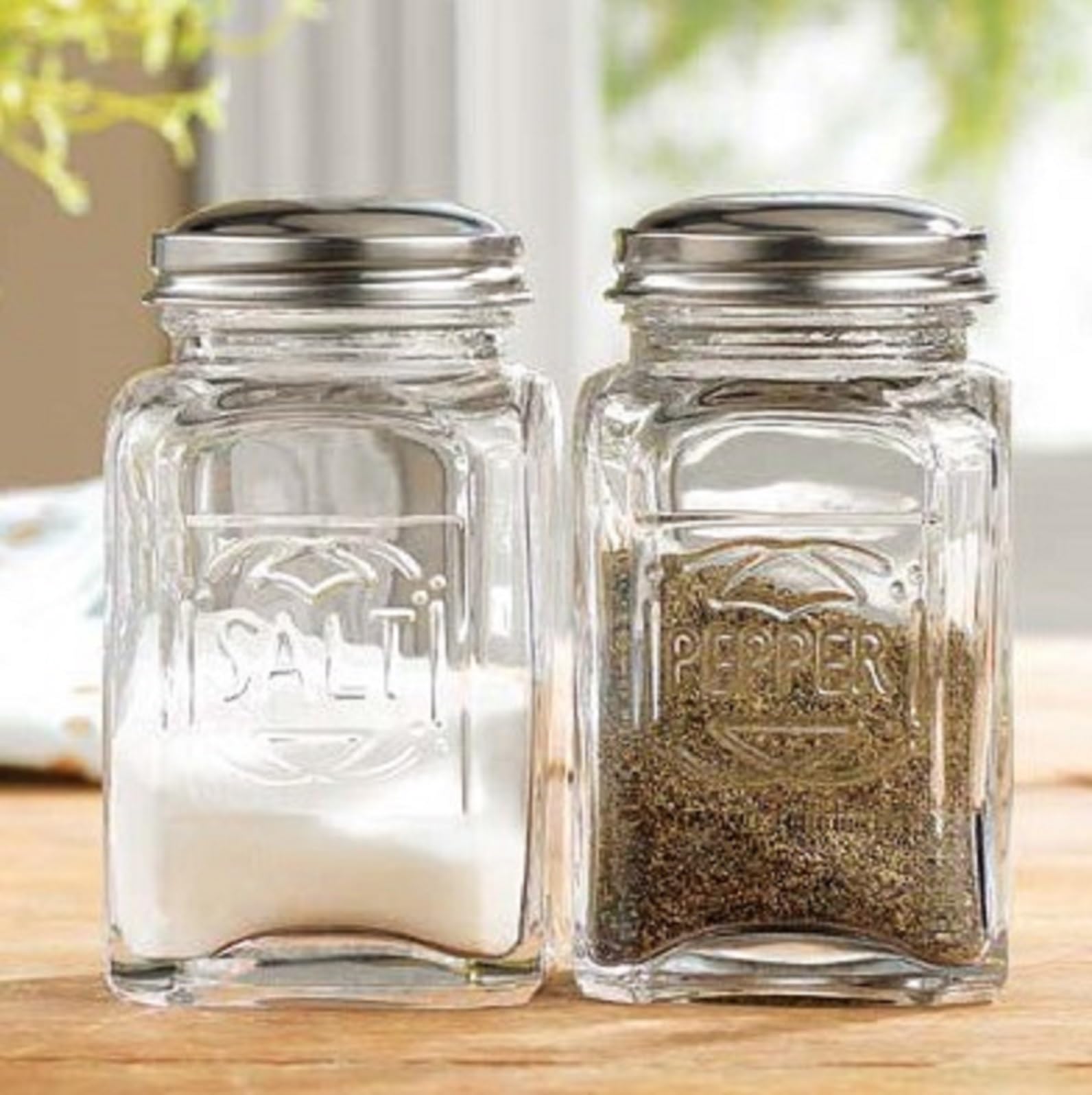 Salt and Pepper Shakers By Home Essentials & Beyond Set of 2 Clear Glass Salt and Pepper Shaker Holders with Stainless Steel Lids.  - Acceptable