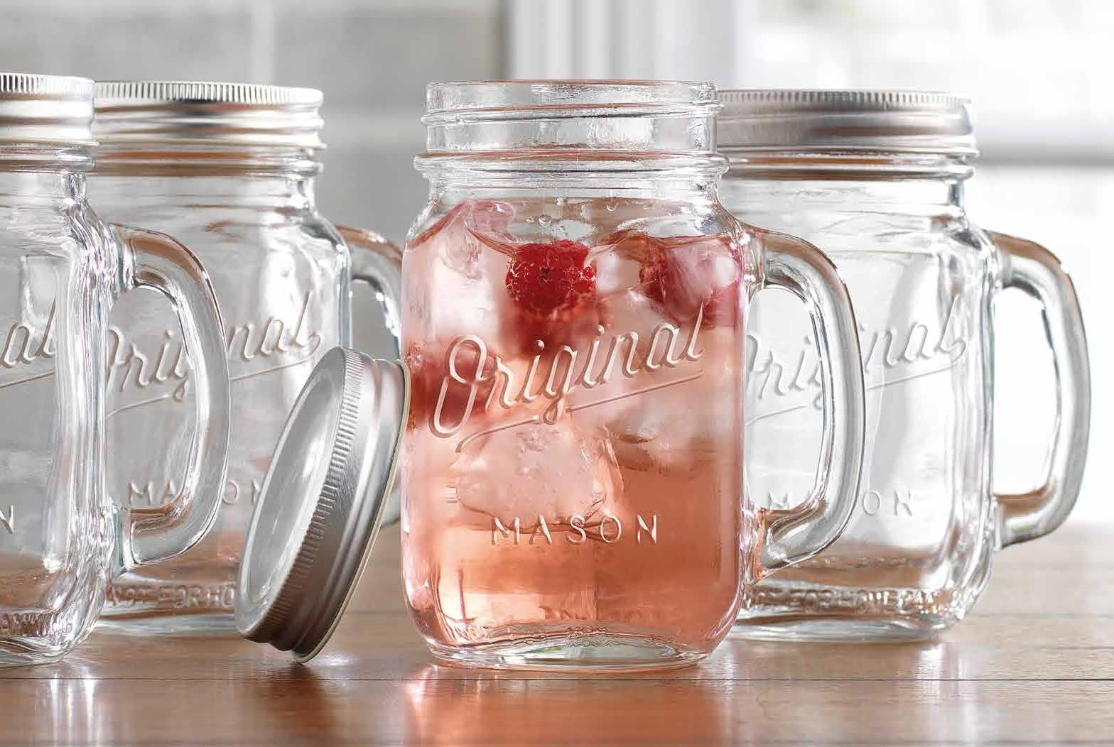 Mason Jar 16 Oz. Glass Mugs with Handle and Lid Set Of 4 - Home Essentials & Beyond - Old Fashioned Drinking Glass Bottles Original Mason Jar Pint Sized Cup Set.  - Acceptable