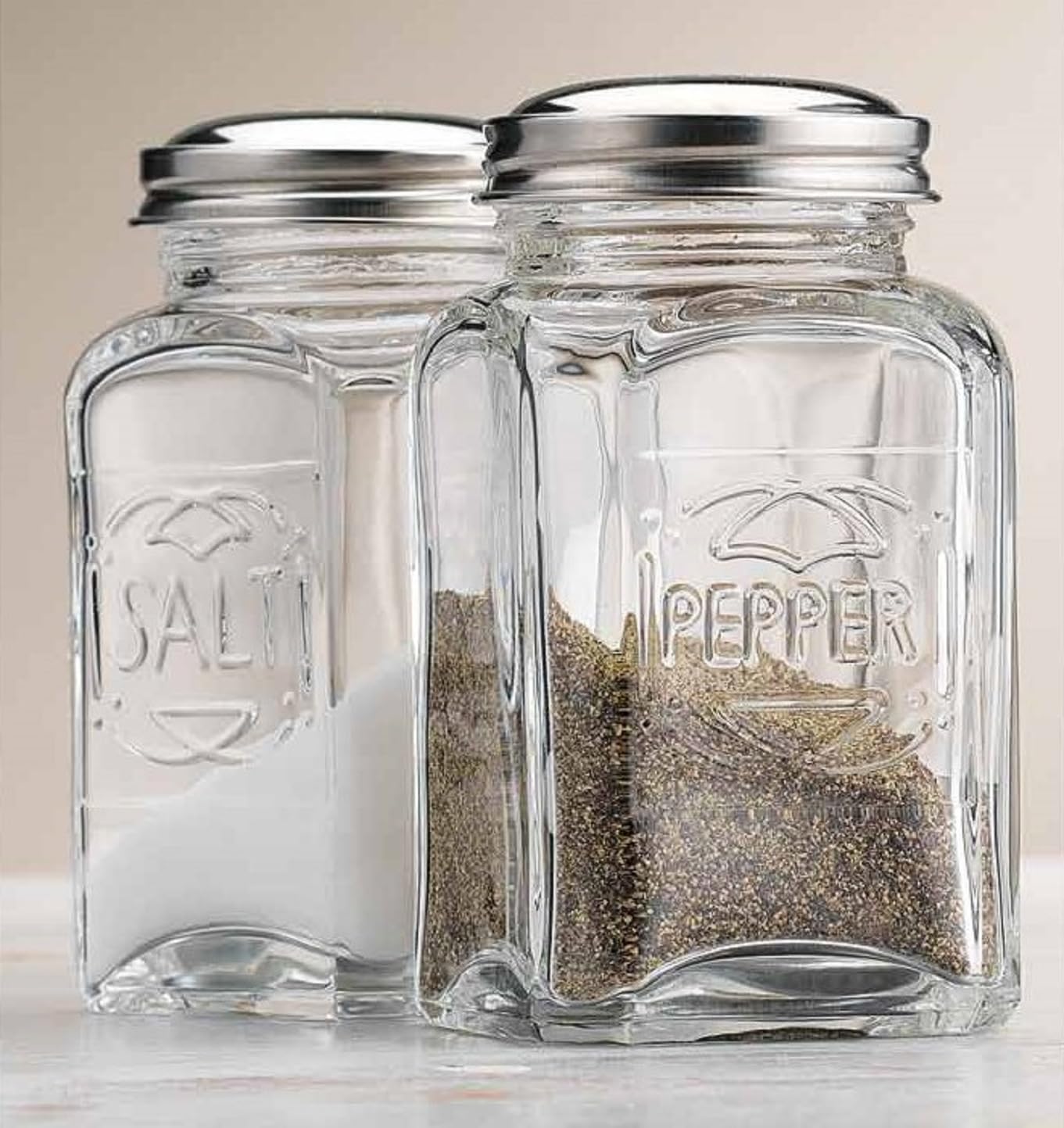 Salt and Pepper Shakers By Home Essentials & Beyond Set of 2 Clear Glass Salt and Pepper Shaker Holders with Stainless Steel Lids.  - Acceptable